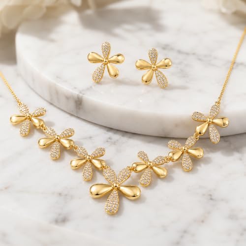 Fleur crystal necklace set arranged on white marble